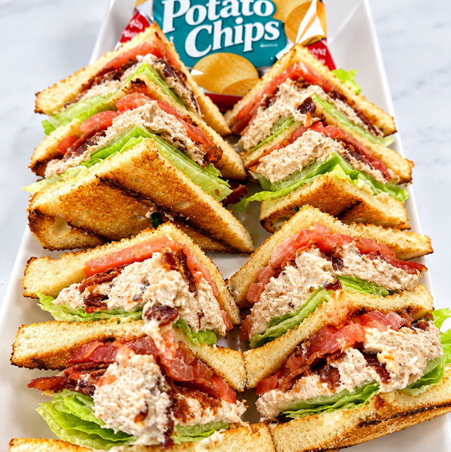 Tuna Club Sandwich With fries.