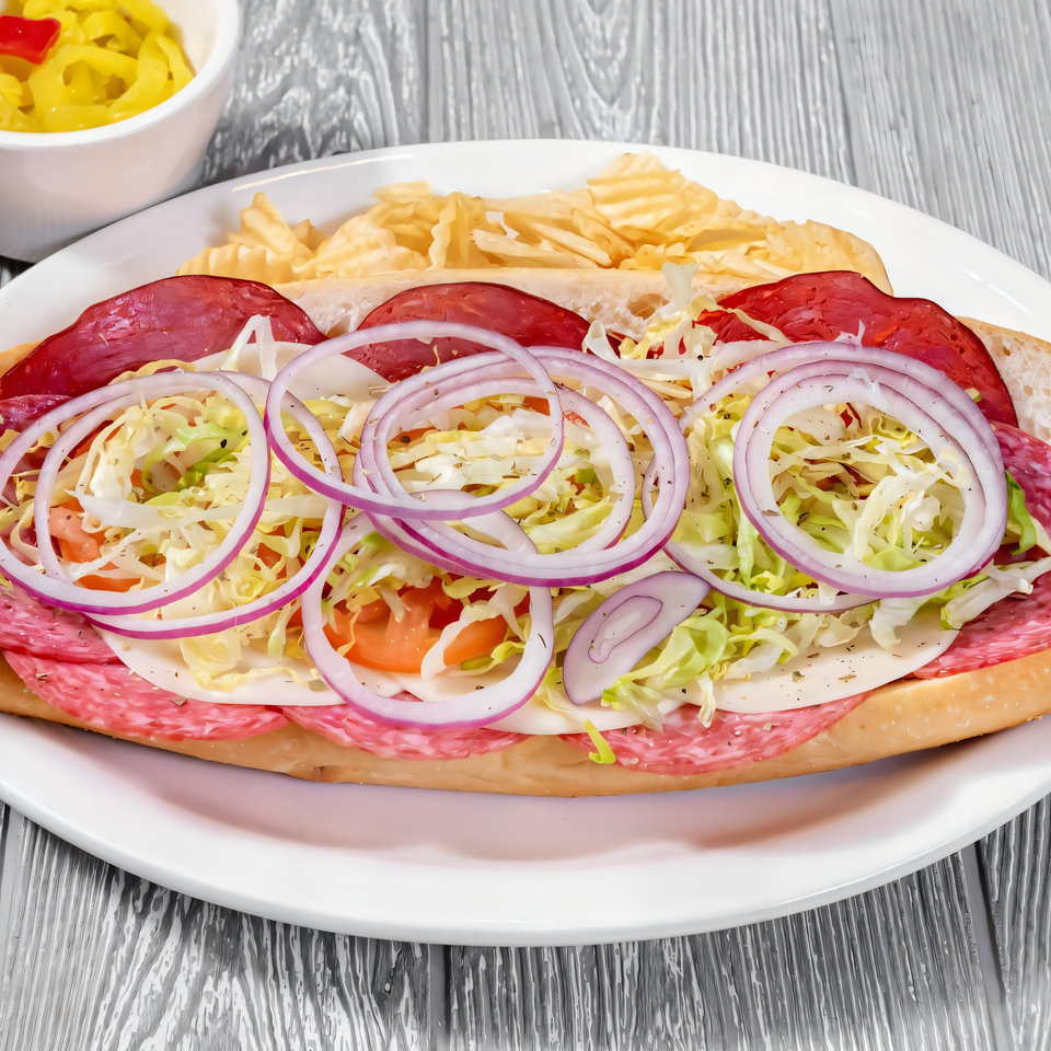 A Tony Sopranos Italian sub with salami, pepperoni, cheese, lettuce, tomato, and red onion.